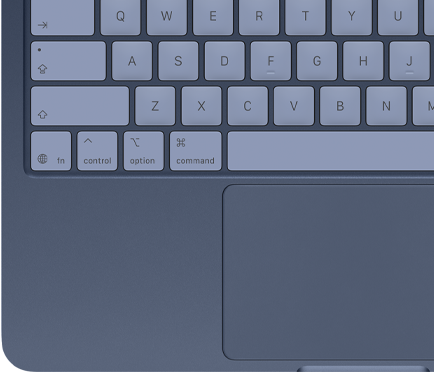 Imagen desde arriba de un MacBook Neo en índigo que muestra las teclas a juego y el trackpad Multi‑Touch